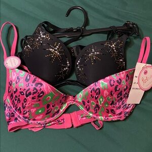 Flirtitude Pink and Green Leopard Bra and a black with rhinestones.
